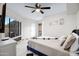 Bright bedroom features natural light, comfortable bed, and tiled floors at 5431 W Cochise Dr, Glendale, AZ 85302