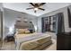Cozy bedroom features soft gray walls, carpet, and natural light at 5431 W Cochise Dr, Glendale, AZ 85302