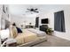 Bedroom with modern furnishings including study desk, comfy bed, and ceiling fan at 5431 W Cochise Dr, Glendale, AZ 85302