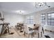 Bright dining area features modern light fixtures, tile floors, and ample seating at 5431 W Cochise Dr, Glendale, AZ 85302