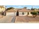 Charming single-story home with a tile roof, a two-car garage, and desert landscaping at 5431 W Cochise Dr, Glendale, AZ 85302
