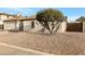 Charming single-story home with a low-maintenance xeriscaped front yard and mature landscaping at 5431 W Cochise Dr, Glendale, AZ 85302