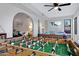 Spacious game room featuring a foosball table, pool table, and comfortable seating area at 5431 W Cochise Dr, Glendale, AZ 85302