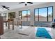This game room includes a Foosball table, and view to an outdoor pool at 5431 W Cochise Dr, Glendale, AZ 85302