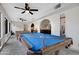 Bright game room has a pool table, foosball, and an adjacent living space at 5431 W Cochise Dr, Glendale, AZ 85302