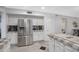 Kitchen boasts stainless steel refrigerator and ample counter space for meal preparation at 5431 W Cochise Dr, Glendale, AZ 85302