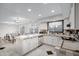 The kitchen includes white cabinets, tile countertops, stainless appliances, and a breakfast bar area at 5431 W Cochise Dr, Glendale, AZ 85302