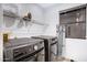 Laundry room with modern washer and dryer, shelving, and natural light at 5431 W Cochise Dr, Glendale, AZ 85302
