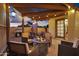 Outdoor area featuring a pergola, string lights, barbecue, dining table, and fire pit at 5431 W Cochise Dr, Glendale, AZ 85302