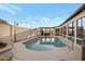 Backyard featuring a sparkling pool, lush landscaping, and stylish patio area with string lights at 5431 W Cochise Dr, Glendale, AZ 85302
