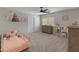 This bedroom features a bed, dresser, and toys at 5917 N 133Rd Ave, Litchfield Park, AZ 85340