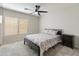 This bedroom features neutral walls, carpet, and a ceiling fan at 5917 N 133Rd Ave, Litchfield Park, AZ 85340