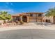 Stunning two-story home featuring a spacious three-car garage and mature palm trees enhancing the curb appeal at 5917 N 133Rd Ave, Litchfield Park, AZ 85340