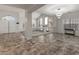 Open-concept design featuring a fireplace, sleek tiled flooring, and great flow for entertaining and relaxing at 5917 N 133Rd Ave, Litchfield Park, AZ 85340
