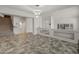 Expansive living area with tiled flooring, stairs, and modern lighting creating a welcoming space at 5917 N 133Rd Ave, Litchfield Park, AZ 85340