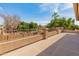 Private covered patio overlooks landscaped backyard, desert trees, pool, and neighborhood at 5917 N 133Rd Ave, Litchfield Park, AZ 85340
