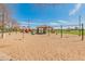 Community playground with swings, slides, picnic pavilion and landscaping, set on a sunny day at 5917 N 133Rd Ave, Litchfield Park, AZ 85340