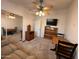 Bedroom features natural carpet, a ceiling fan, and closet with mirrored doors at 650 N Hawes Rd # 4609, Mesa, AZ 85207