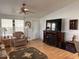 Relaxing space with a plush recliner, media center with fireplace, and a ceiling fan at 650 N Hawes Rd # 4609, Mesa, AZ 85207