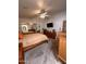 Generous main bedroom boasts ceiling fan, mirrored closets, carpeting, and ample natural light at 650 N Hawes Rd # 4609, Mesa, AZ 85207