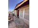 Side patio with metal railing, seating, and a partial awning overhead at 650 N Hawes Rd # 4609, Mesa, AZ 85207