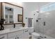 Modern bathroom featuring white vanity, quartz countertop, glass-enclosed shower, and stylish fixtures at 6790 S Springs Pl, Chandler, AZ 85249