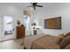 Bedroom featuring an exterior door, mini bar, and an abstract art piece at 6790 S Springs Pl, Chandler, AZ 85249