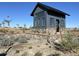 Modern community building with stone base, vertical siding, and clerestory windows surrounded by desert landscaping at 6790 S Springs Pl, Chandler, AZ 85249