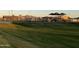Expansive community park featuring a playground, covered seating, and lush green space at 6790 S Springs Pl, Chandler, AZ 85249