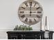Close-up on a decorated console table with a stylish clock and silver vases against a white wall at 6790 S Springs Pl, Chandler, AZ 85249