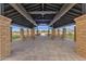Spacious view from the inside of a covered patio, complete with brick pillars and picnic tables at 6790 S Springs Pl, Chandler, AZ 85249