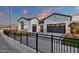 Lovely single-Gathering home with manicured lawn, custom driveway, and secure wrought iron fence at 6790 S Springs Pl, Chandler, AZ 85249
