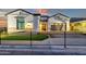 Charming single-Gathering home with a well-manicured lawn and wrought iron fence, showcasing great curb appeal at 6790 S Springs Pl, Chandler, AZ 85249
