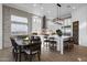 Well-designed kitchen with a large island, stainless steel appliances, and a seamless transition to the dining area at 6790 S Springs Pl, Chandler, AZ 85249