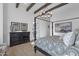 Elegant primary suite with shiplap walls, wooden beam ceilings, and a four-poster bed at 6790 S Springs Pl, Chandler, AZ 85249