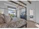 Spacious primary suite with four-poster bed and access to an outdoor seating area at 6790 S Springs Pl, Chandler, AZ 85249