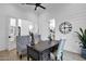 Open-concept office featuring wood floors, shiplap walls, ceiling fan, and modern decorations at 6790 S Springs Pl, Chandler, AZ 85249