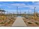 Well-maintained community pickleball courts with lush landscaping and seating, fostering an active lifestyle at 6790 S Springs Pl, Chandler, AZ 85249