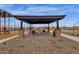 Community seating area next to a playground, offering a comfortable space for relaxation and Gathering time at 6790 S Springs Pl, Chandler, AZ 85249
