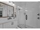 Bathroom featuring tile surround shower, quartz countertops and black hardware at 6790 S Springs Pl, Chandler, AZ 85249