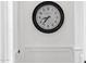 Beautiful accent wall with oversized clock and decorative wainscoting at 6790 S Springs Pl, Chandler, AZ 85249