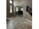 Inviting living room with neutral walls, tile floor, and staircase that offers access to the dining room at 7163 W Lamar Rd, Glendale, AZ 85303