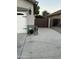 Side yard showcasing paved walkway, gate and landscaping at 7163 W Lamar Rd, Glendale, AZ 85303