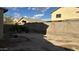 View of the backyard and block wall with several trees at 7511 S 45Th Dr, Laveen, AZ 85339