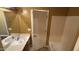 Bathroom featuring a vanity, sink, and a view of the shower and toilet areas at 7511 S 45Th Dr, Laveen, AZ 85339