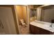 Bathroom view with a toilet, sink, mirror, walk in shower, and nice cabinets at 7511 S 45Th Dr, Laveen, AZ 85339