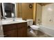 Functional bathroom featuring a vanity, toilet, and bathtub/shower combo, ideal for everyday convenience at 7511 S 45Th Dr, Laveen, AZ 85339