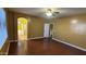 Large primary bedroom with hardwood floors, ceiling fan, and connected bathroom with tub and shower at 7511 S 45Th Dr, Laveen, AZ 85339