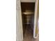 Walk-in closet with shelving and tile flooring, providing ample storage space for an organized home at 7511 S 45Th Dr, Laveen, AZ 85339