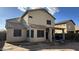 Exterior view of the rear of the house showing the covered patio at 7511 S 45Th Dr, Laveen, AZ 85339